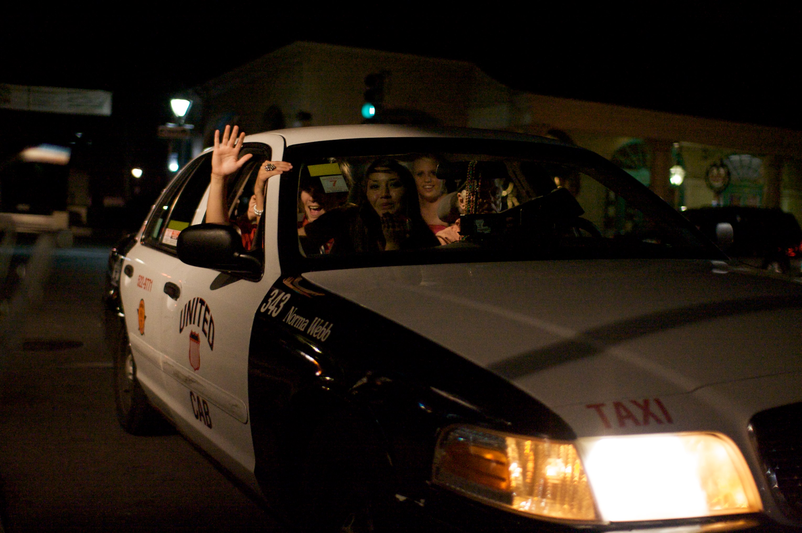 A Crown Vic wearing black and white United Cab livery with at least five passengers. Possibly an entire bachelorette party? They are drunk. One is waving out an open window and screaming, the one on her lap is blowing me a kiss through the front window. The drivers' face is partially obscured by beads hanging off the mirror and his expression is pretty deadpan, but I like to think that he believes fares like these are what make New Orleans the best place in the world, as long as they don't throw up in his car.